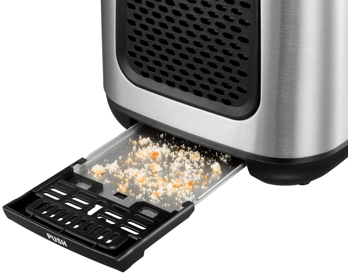 Eine Nahaufnahme des Unold Turbo Toasters B-Ware zeigt die herausgezogene schwarze Kunststoff-Krümelschublade mit der Aufschrift „PUSH“, die die gesammelten Brotkrümel freigibt. Der Toaster verfügt über ein Edelstahlgehäuse.