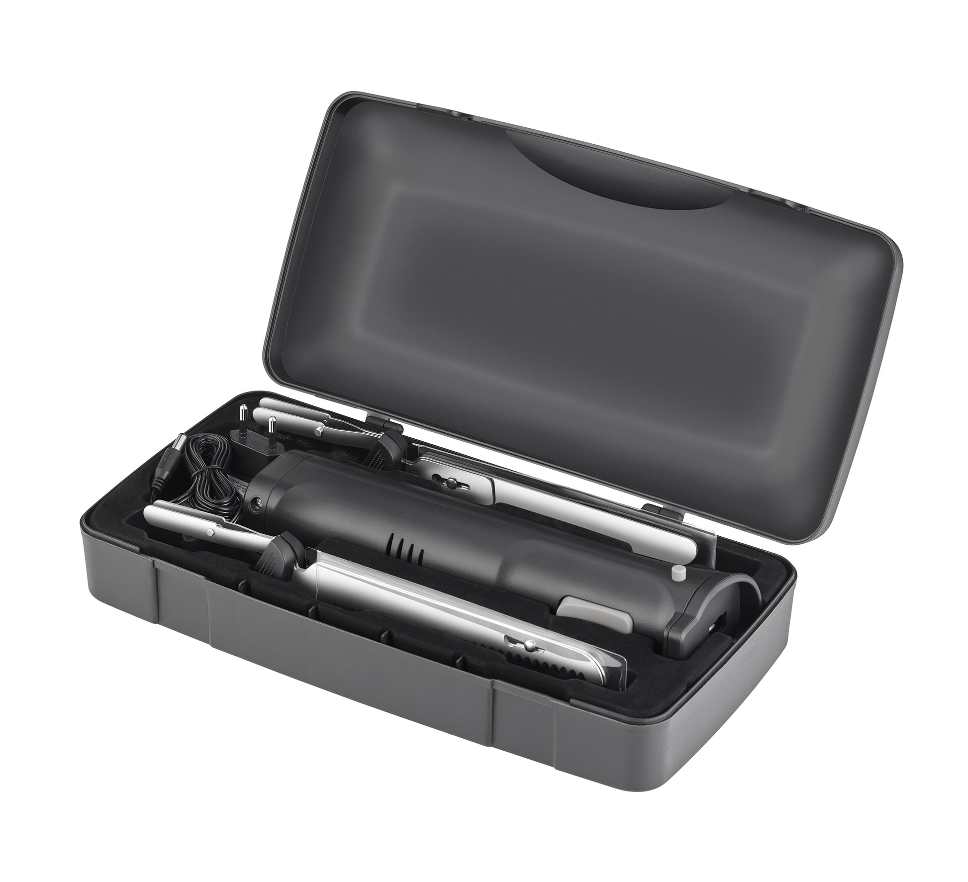 Das Unold Elektromesser Cordless wird in einem schwarzen Kunststoffkoffer mit Schaumstoffeinlage geliefert und verfügt über einen Hauptgriff, verschiedene Aufsätze und ein Netzkabel für vielseitiges elektrisches Haarstyling.