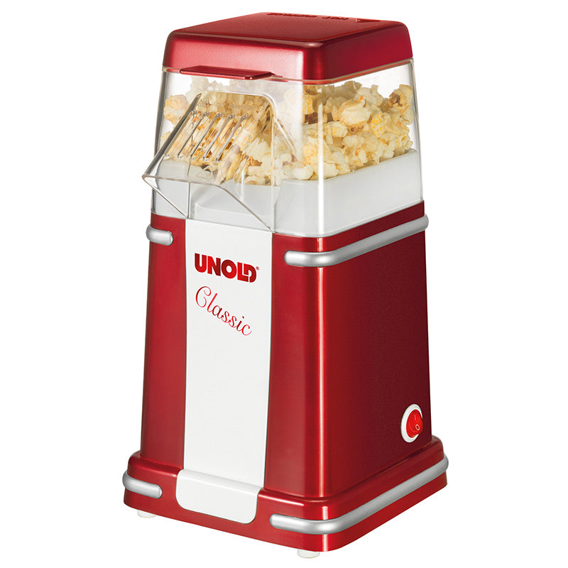 Der Unold Popcornmaker Classic in Rot und Weiß verfügt über eine transparente Oberseite, die mit Popcorn gefüllt ist, und einen kleinen seitlichen Netzschalter.