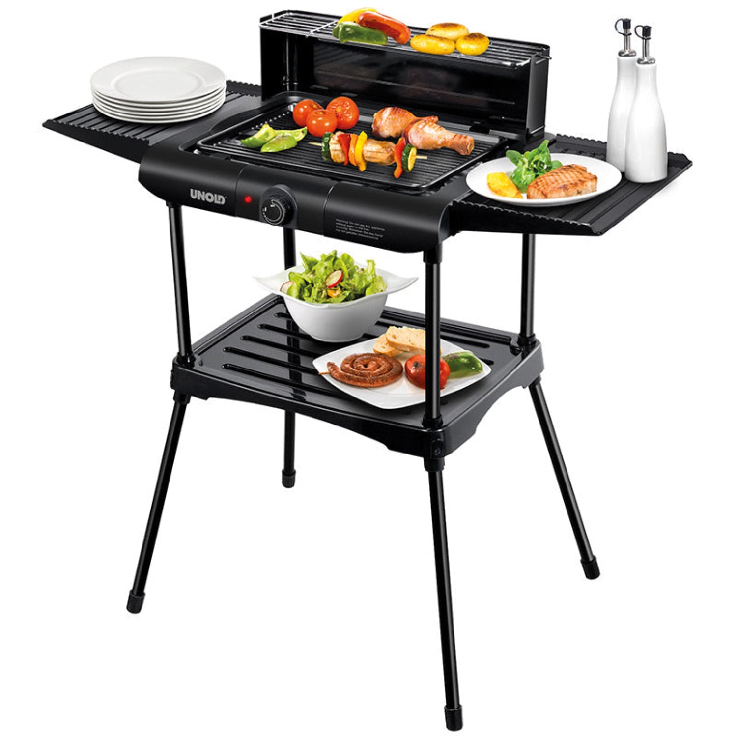 Der Unold 58565 Barbecue-Grill Vario von Unold ist ein schwarzer Elektrogrill, der mit Gemüse und Fleisch auf dem Rost, Salaten und Brot auf der unteren Ablage und zwei Flaschen für Öl oder Essig auf der Seitenablage abgebildet ist.