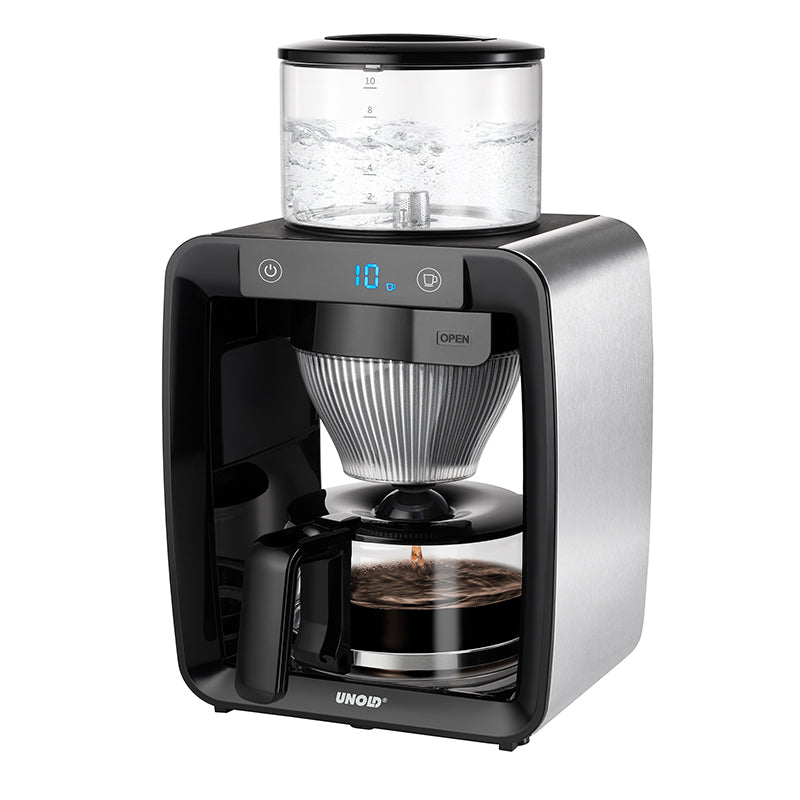 Der Unold Kaffeeautomat Aroma Star ist eine moderne elektrische Kaffeemaschine mit Digitalanzeige, Glaswassertank oben, Glaskanne darunter und einem Gehäuse aus schwarzem Edelstahl, abgebildet beim Kaffeekochen.